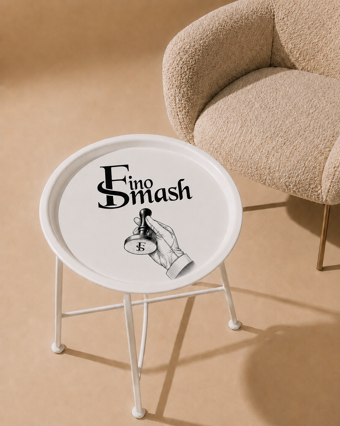 FinoSmash campaign: a white side table printed with the FinoSmash wordmark and hand-and-presser mark